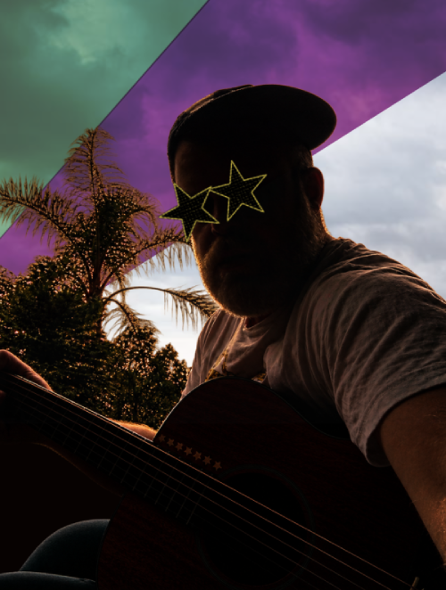 Jay Bones playing acoustic guitar in silhouette with palm trees and graphic sky